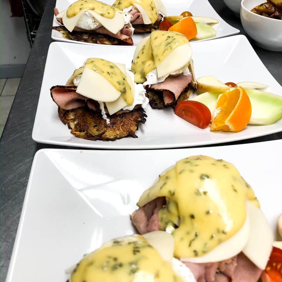 Eggs on the nest Potato pancake topped with black forest ham poached egg cheese and fresh made sauce hollandaise.