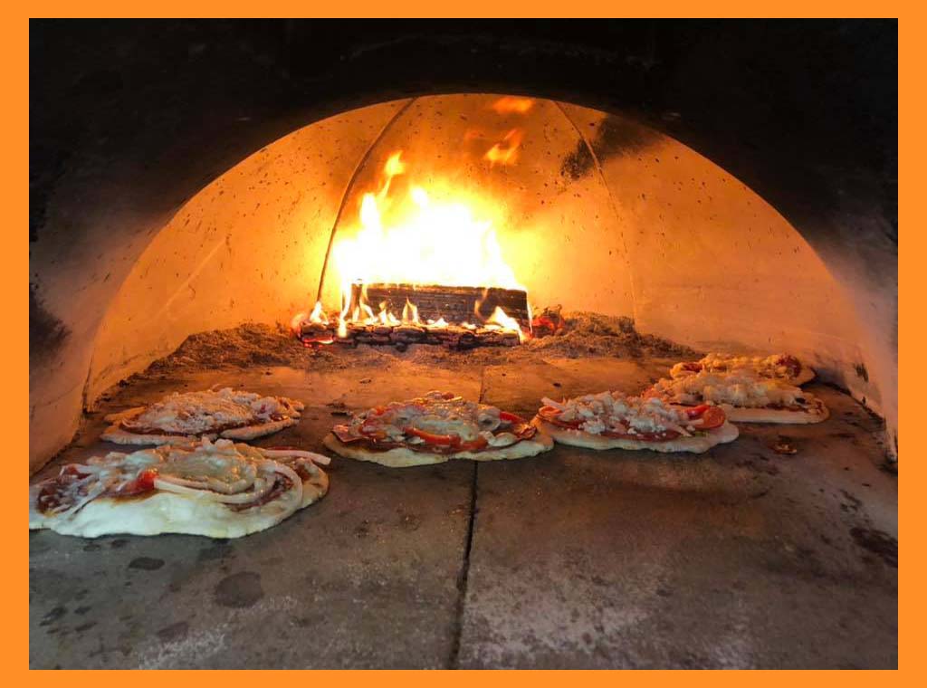 Pizza in the Wood Fired oven. Join us for a night or order takeout!